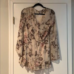 NWT. Floral and flowy romper.